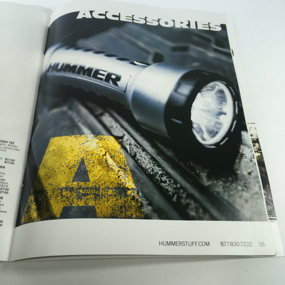 Interior page of the 2009 Hummer Apparel and Accessories Brochure Catalog highlighting Hummer accessories, including a flashlight.