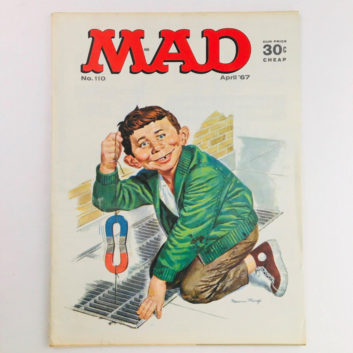 Front cover of Mad Magazine April 1967 No. 110 featuring a cartoon boy with a magnet manipulating a grate, showcasing the humorous and iconic style of vintage magazines.