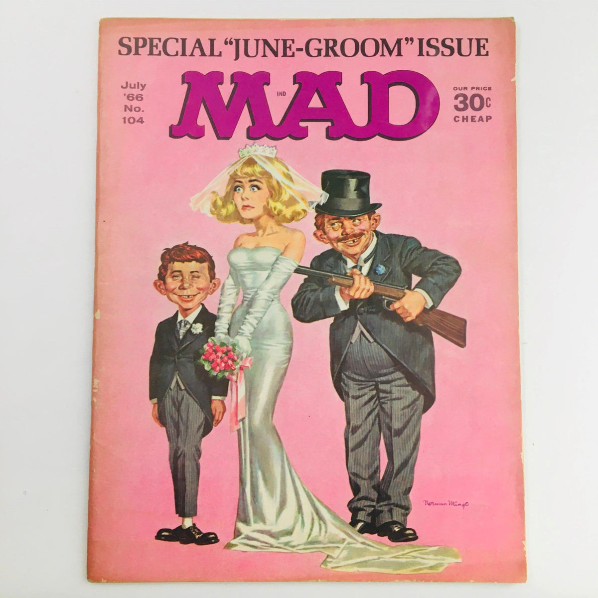 Cover of Mad Magazine July 1966 No. 104 June Groom Issue featuring a humorous illustration of a bride and groom with exaggerated facial features. The cover showcases the iconic Mad Magazine style with vibrant pink background.