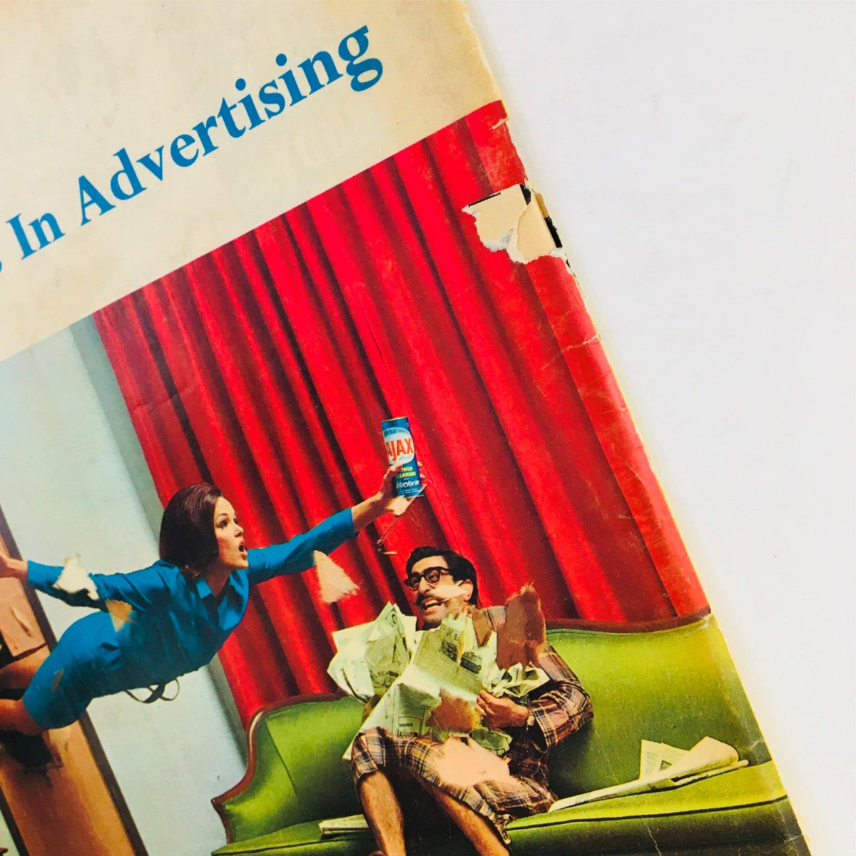 Cover illustration from Mad Magazine October 1965 No. 98 featuring a humorous scene with a woman in a blue dress playfully throwing a can of Jax at a man sitting on a green couch surrounded by scattered papers, reflecting the playful satire and pop culture of the era.