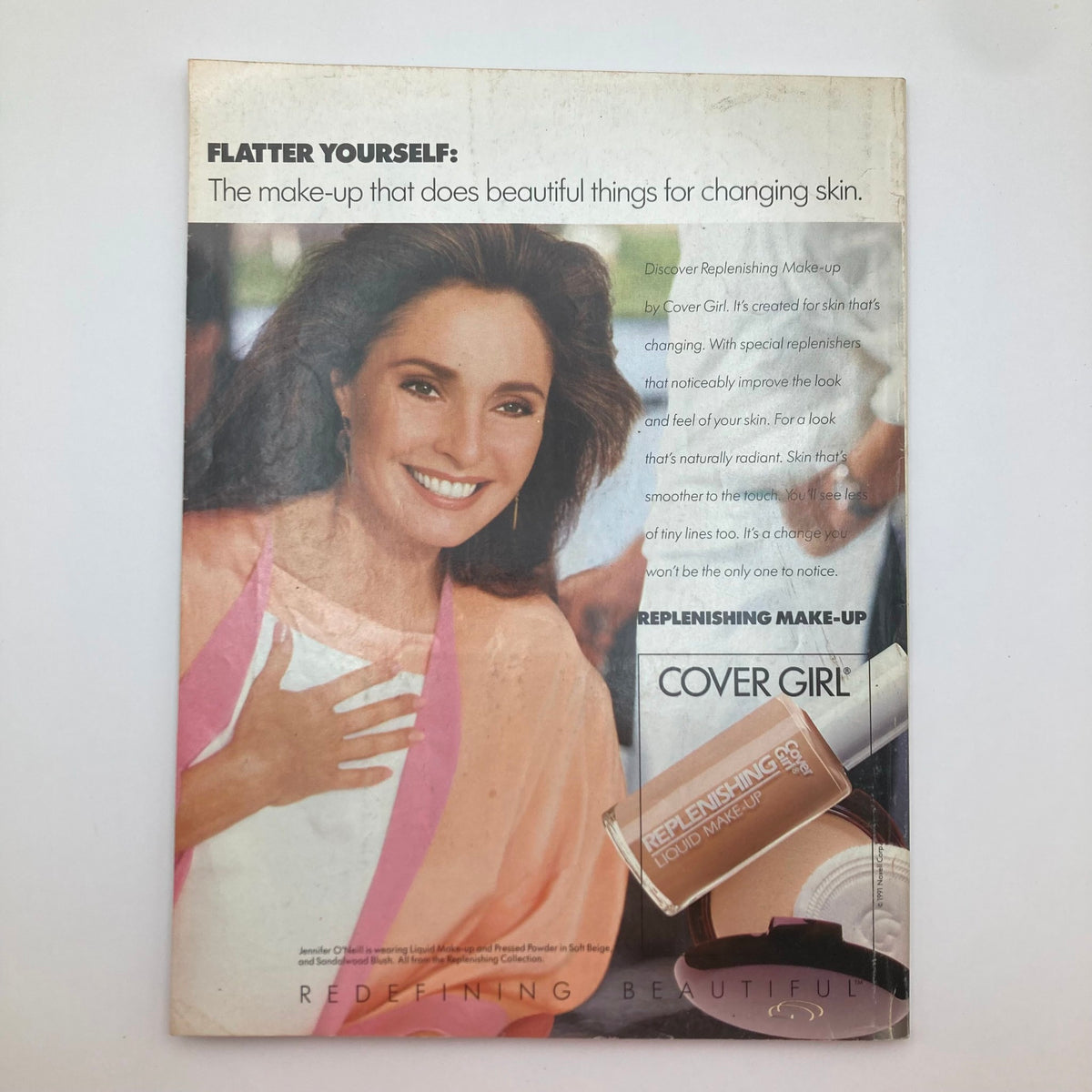 Back cover of McCall's Magazine June 1991 advertising Cover Girl Replenishing Make-Up with a model showcasing vibrant skin and beauty tips.
