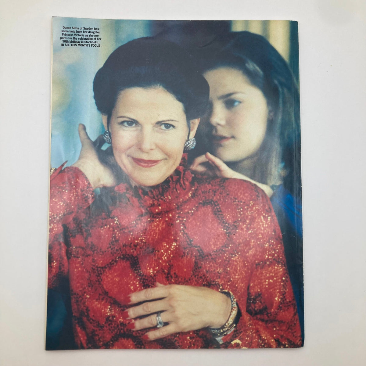 Back cover of Royal Magazine 1994 Vol 12 No. 10, showcasing an image of Queen Silvia of Sweden with her daughter, emphasizing the royal family's personal dynamics.