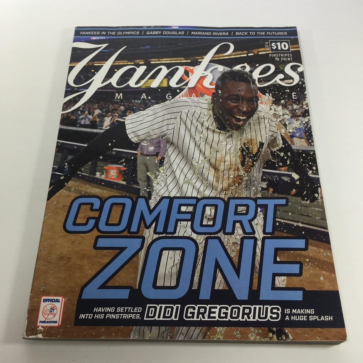 Cover of Yankees Magazine: August 2016 Volume #37-6 featuring Didi Gregorius celebrating in the rain with the headline 'Comfort Zone' showcasing his impact on the New York Yankees.