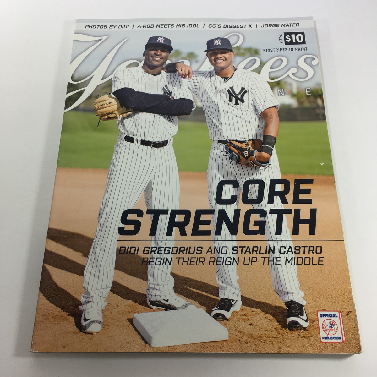 Cover of Yankees Magazine: April 2016 Volume 37-2 featuring Didi Gregorius and Starlin Castro, showcasing players in Yankees uniforms on the baseball field, emphasizing their core strength.