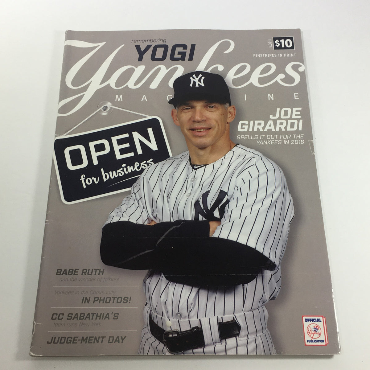 Cover of Yankees Magazine Spring 2016 Volume 37-1 featuring Joe Girardi with the headline 'OPEN for business' highlighting Yankees insights and strategies.