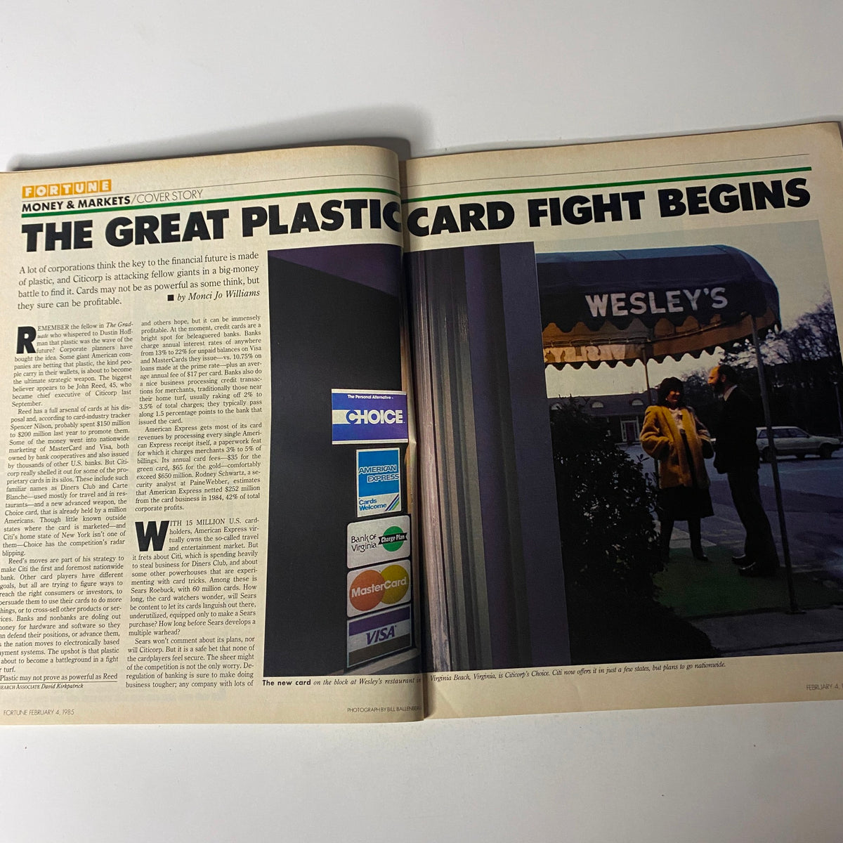 Inside page of Fortune Magazine February 4, 1985, featuring the cover story 'The Great Plastic Card Fight Begins' with visuals of various credit cards and an outdoor scene.