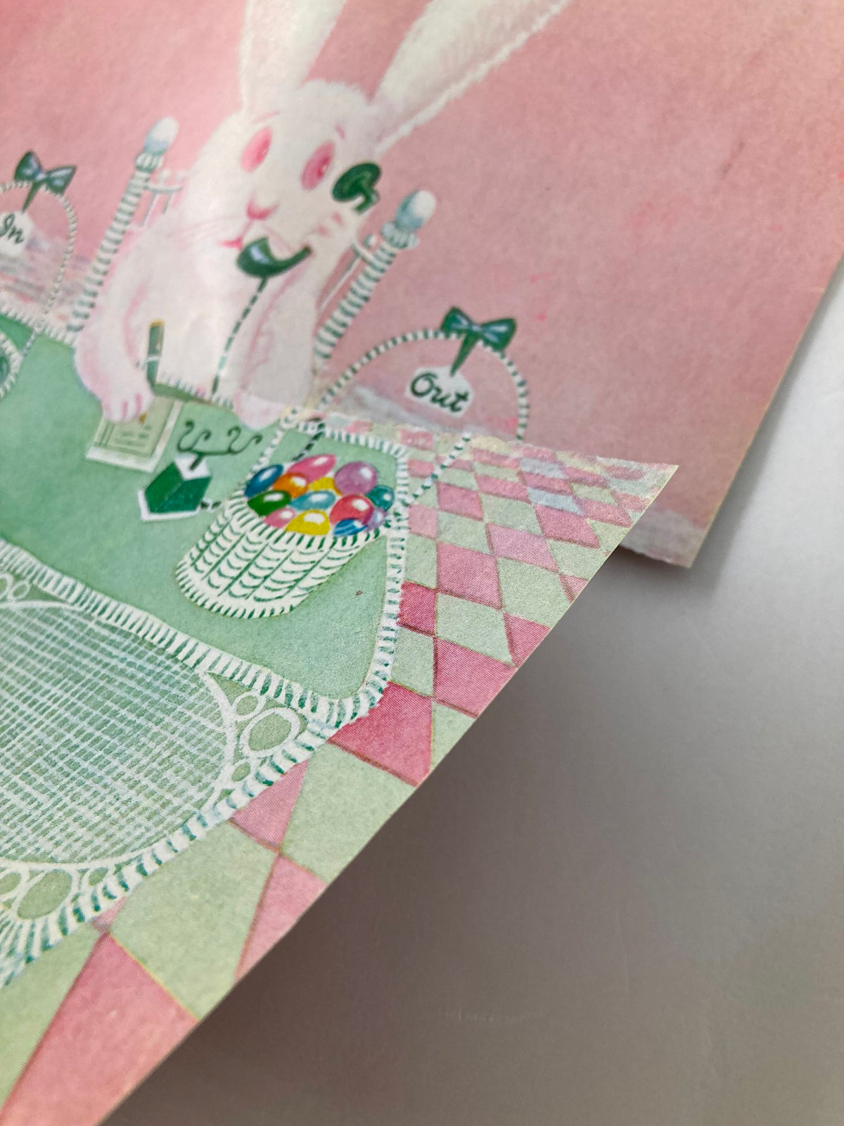 Close-up view of The New Yorker April 15, 1974 cover, illustrated by Chas Addams, highlighting intricate details of the bunny on the phone and festive decor.
