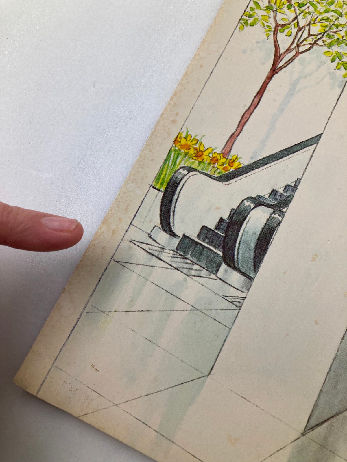 Close-up view of the The New Yorker cover dated April 25, 1983, illustrated by Charles Saxon, focusing on the indoor environment and minor wear details.
