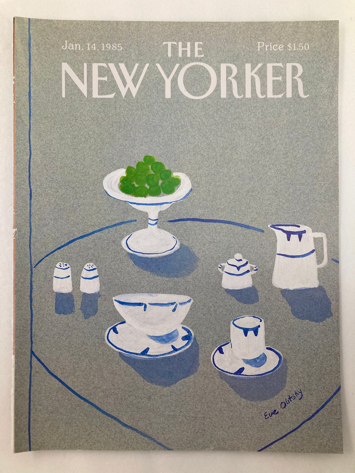 Cover of The New Yorker, January 14, 1985, showcasing 'Tea Time' artwork by Eve Olitsky, featuring a stylish arrangement of tea cups, a teapot, and a plate of green fruits.