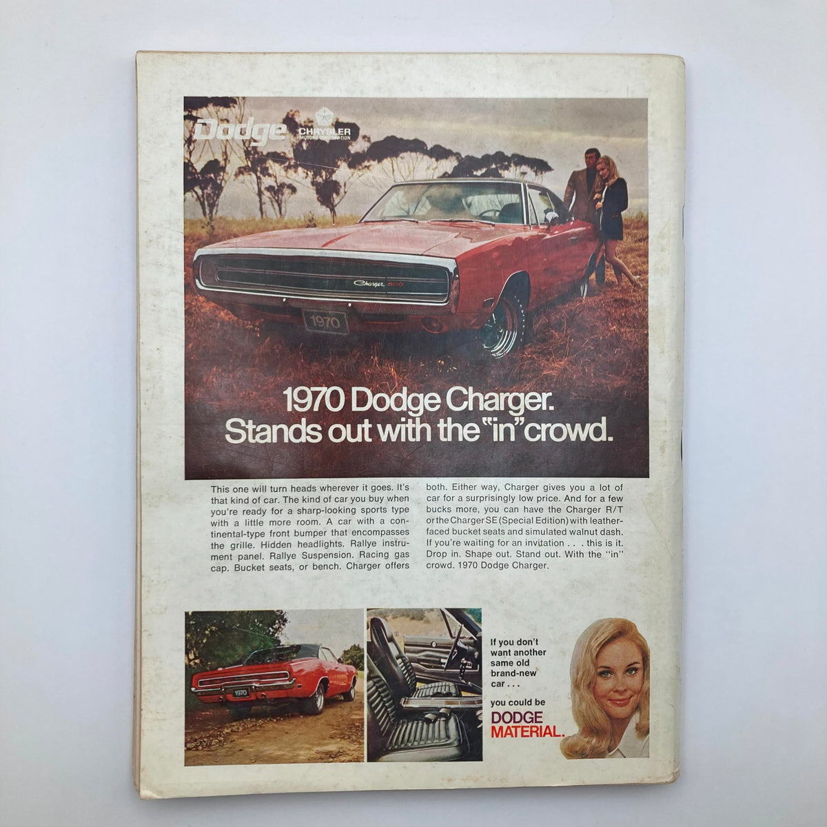 Back cover of Vintage Playboy Magazine December 1969 featuring a vintage advertisement for the 1970 Dodge Charger, blending automotive and cultural history.