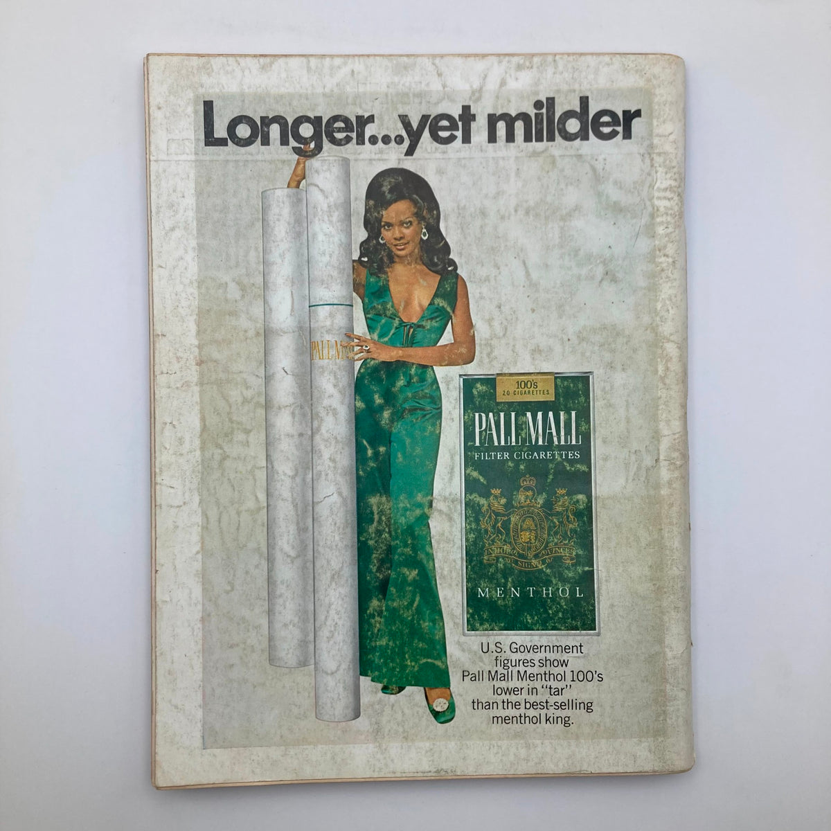 Cover of Playboy Magazine November 1969 featuring an advertisement for Pall Mall Menthol cigarettes, showcasing a model in a green dress, promoting the brand with the tagline 'Longer...yet milder'. This issue includes the iconic centerfold of Claudia Jennings.