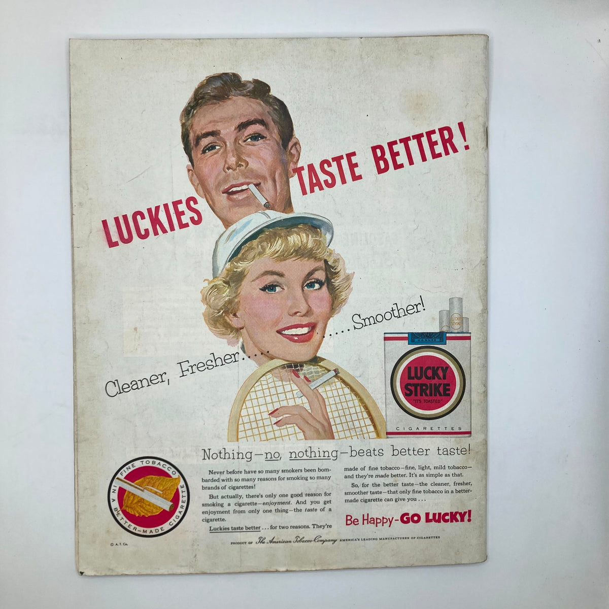 Back cover of the Saturday Evening Post Magazine from August 22, 1953 featuring a vintage advertisement for Lucky Strike cigarettes with a smiling couple.