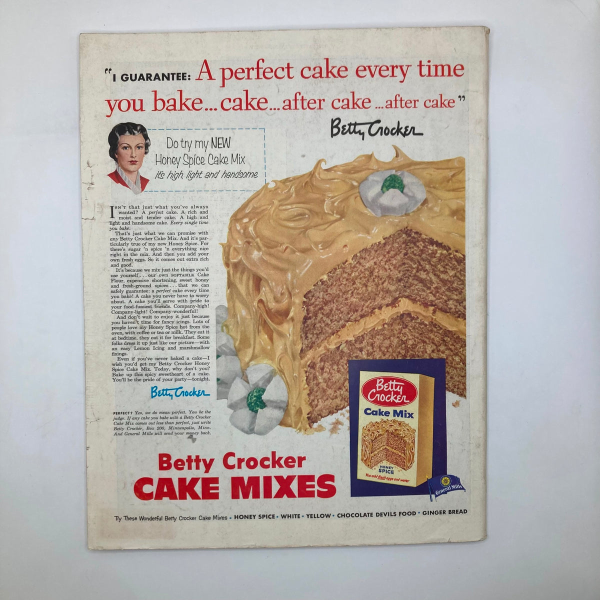 Advertisement on the back cover of the Saturday Evening Post Magazine June 20 1953, promoting Betty Crocker Cake Mixes with a delicious image of a cake.