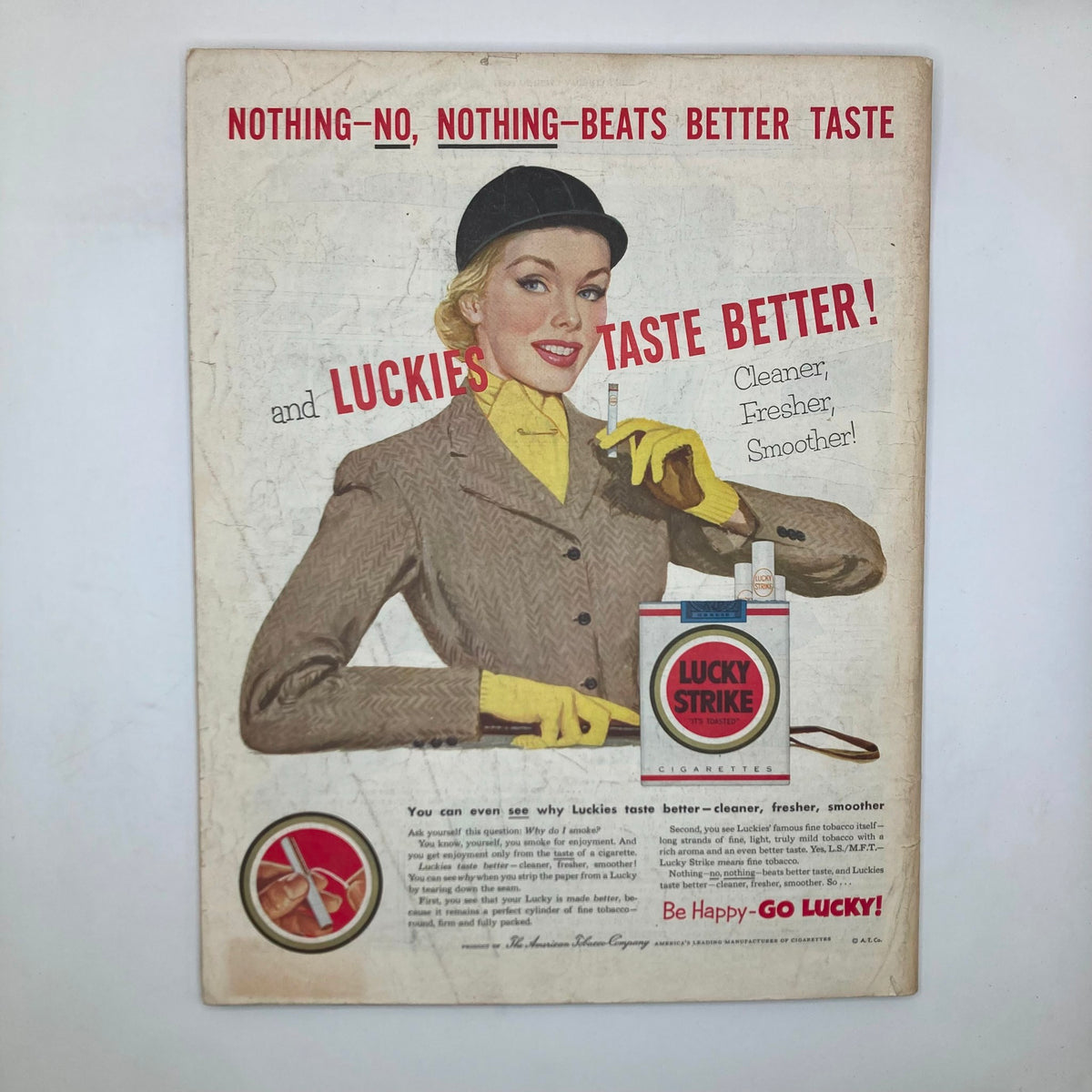 Vintage advertisement featured in the Saturday Evening Post Magazine dated May 30, 1953 for Lucky Strike cigarettes, showcasing a woman dressed in a stylish outfit with a cigarette.