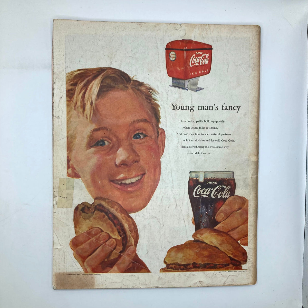 Back cover of Saturday Evening Post Magazine May 16, 1953, featuring a vintage Coca-Cola advertisement with a smiling boy holding food and drink, exemplifying 1950s American culture.