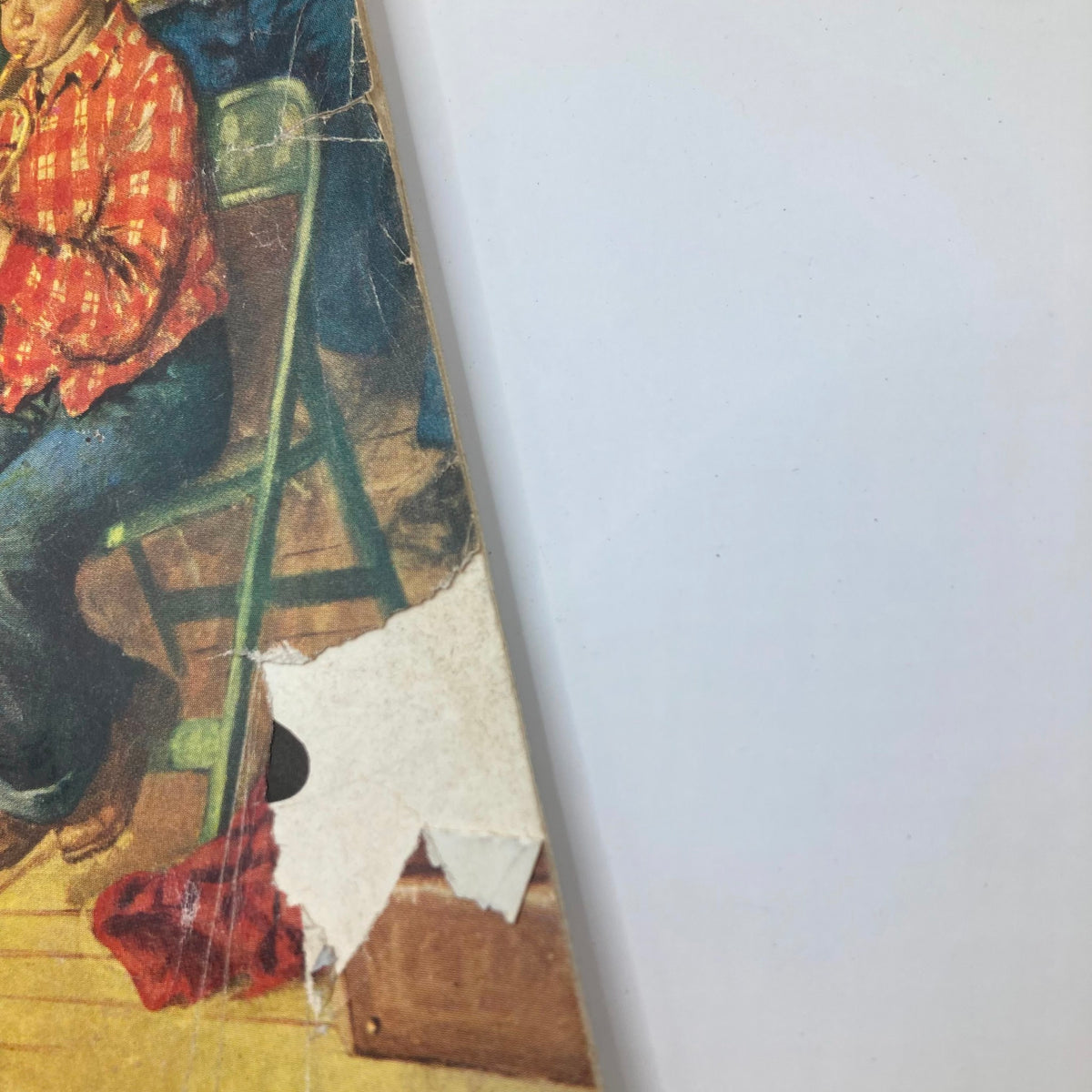 Back cover of the Saturday Evening Post Magazine March 22 1952 showing a young boy sitting in a chair with a plaid shirt, capturing the nostalgic essence of 1950s childhood.