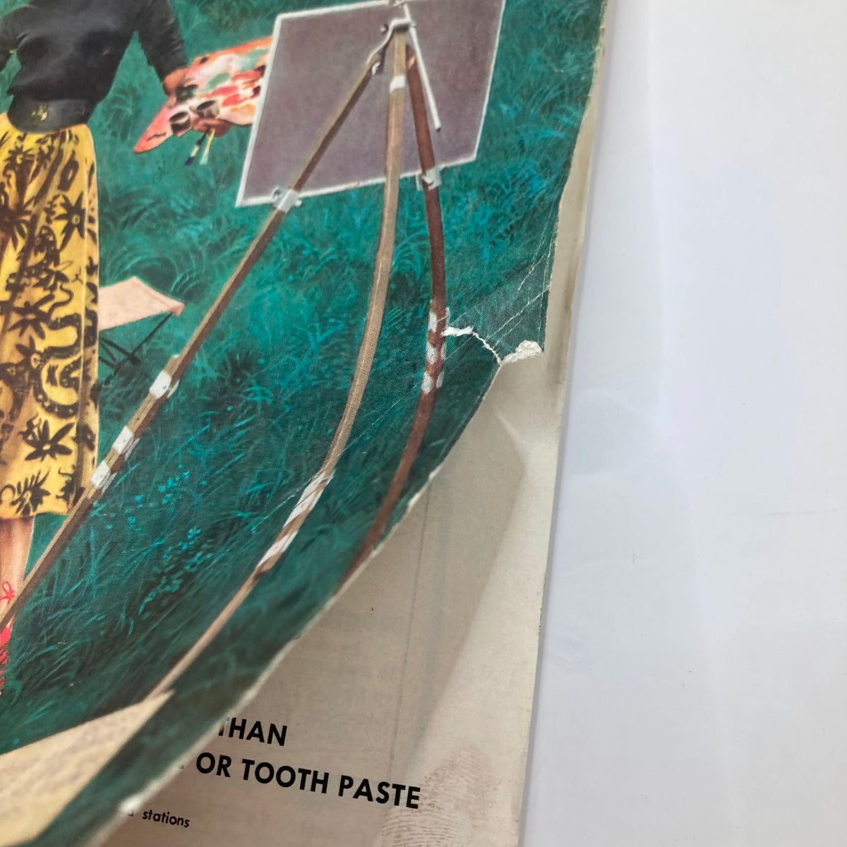 Detail shot of the Saturday Evening Post Magazine cover from June 6, 1953 featuring Miss Brushley by George Hughes. Displays the edge of the magazine and an easel used for painting.