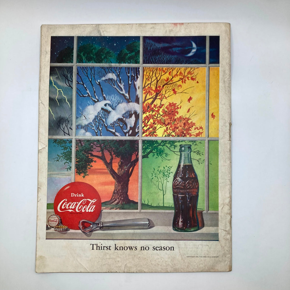 Back cover of the Saturday Evening Post Magazine December 27, 1952, showcasing a colorful Coca-Cola advertisement emphasizing the seasonal message 'Thirst Knows No Season'.