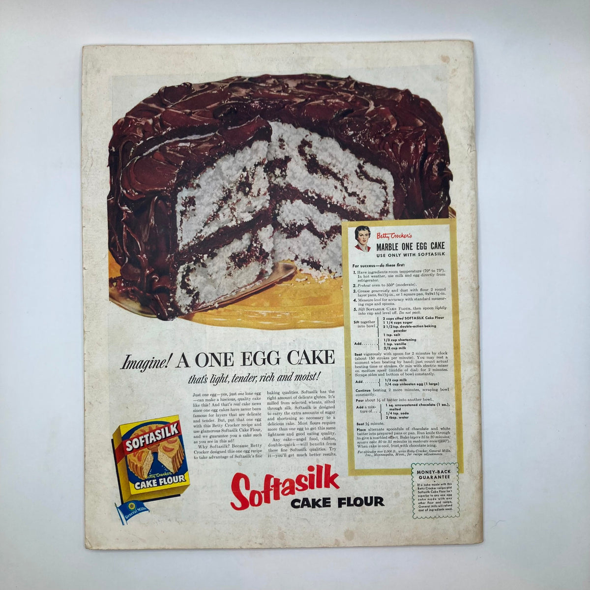 Advertisement page for Softeak Cake Flour from the Saturday Evening Post Magazine August 16, 1952, featuring a tempting image of a marble one egg cake with a recipe for baking.