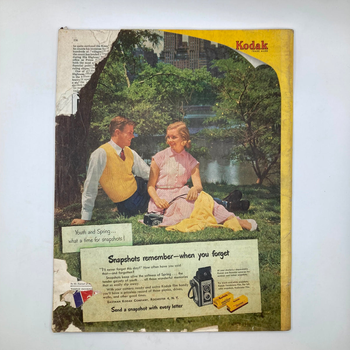Back cover of the Saturday Evening Post Magazine April 22, 1952 featuring a Kodak advertisement with a couple enjoying a day in the park.