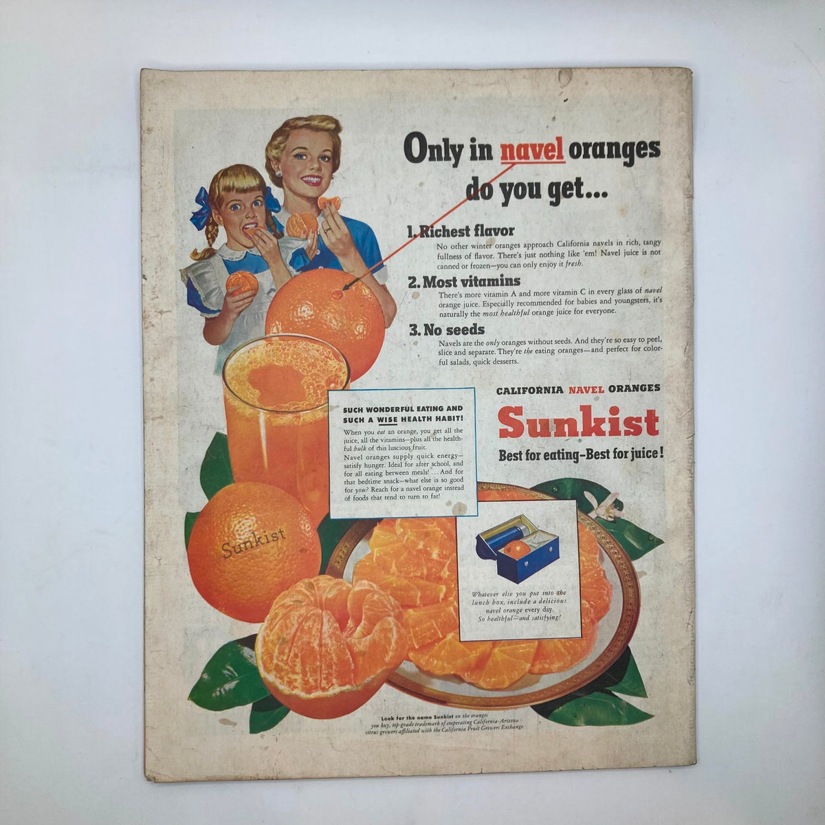 Back cover of the Saturday Evening Post Magazine January 19 1952 with an advertisement for Sunkist navel oranges featuring two women enjoying oranges.