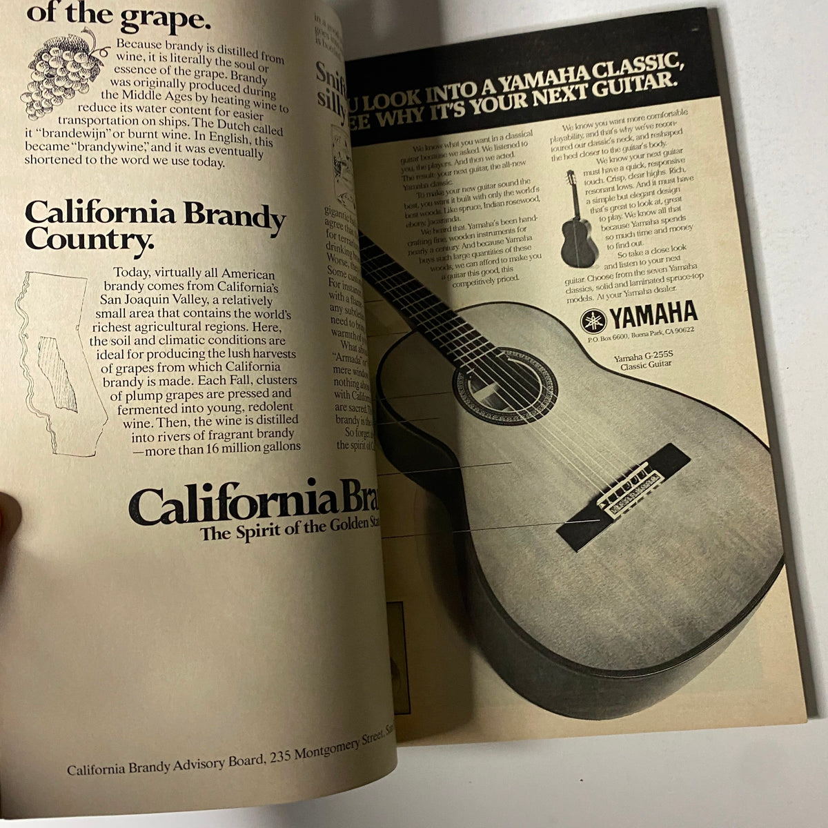 An interior ad in Esquire Magazine December 1977 promoting California Brandy, featuring an image of a Yamaha guitar and text discussing California's rich agricultural heritage.