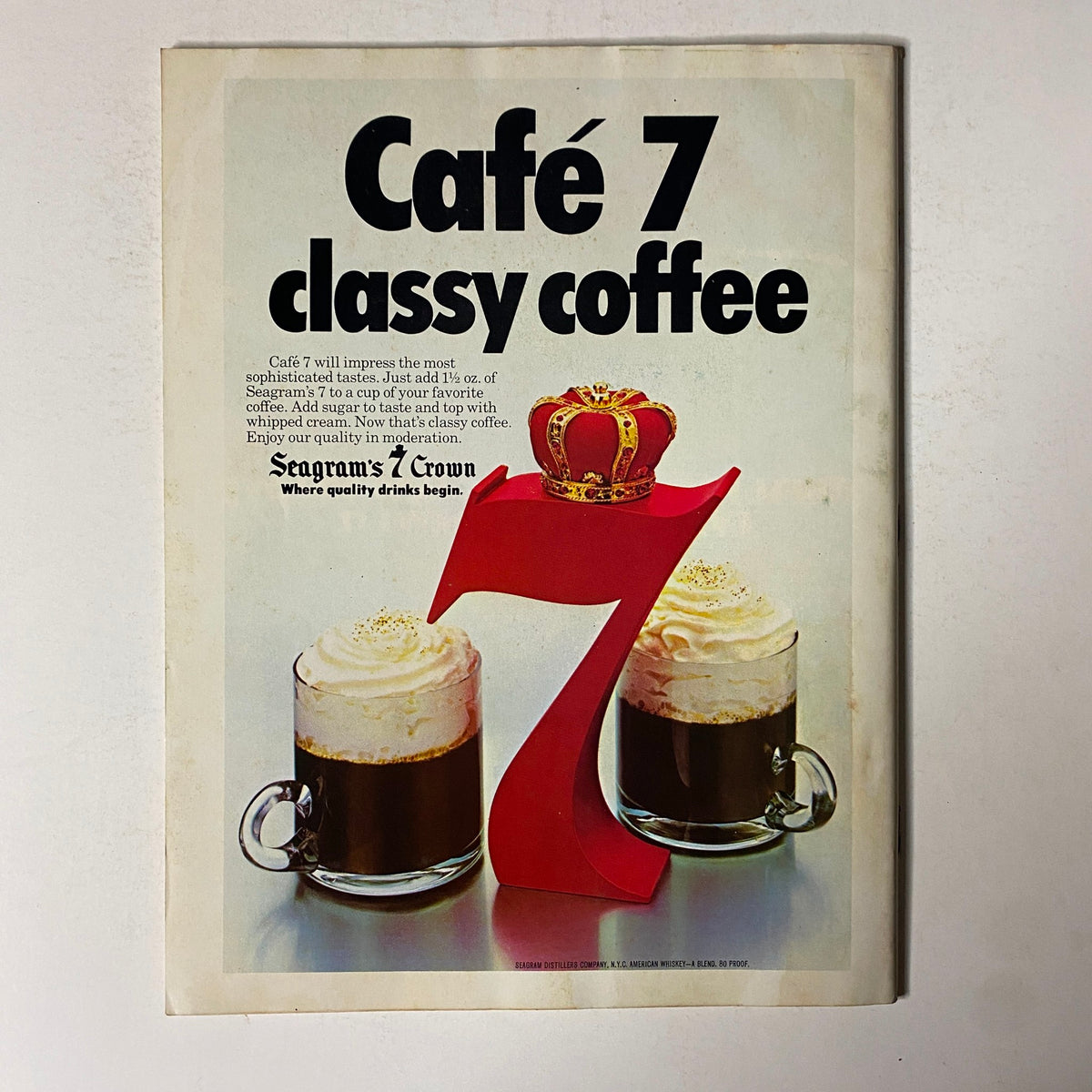 Advertisement from Esquire Magazine January 30, 1979, for Café 7 classy coffee, showcasing a creative design with Seagram's 7 Crown whiskey and two coffee mugs topped with whipped cream.