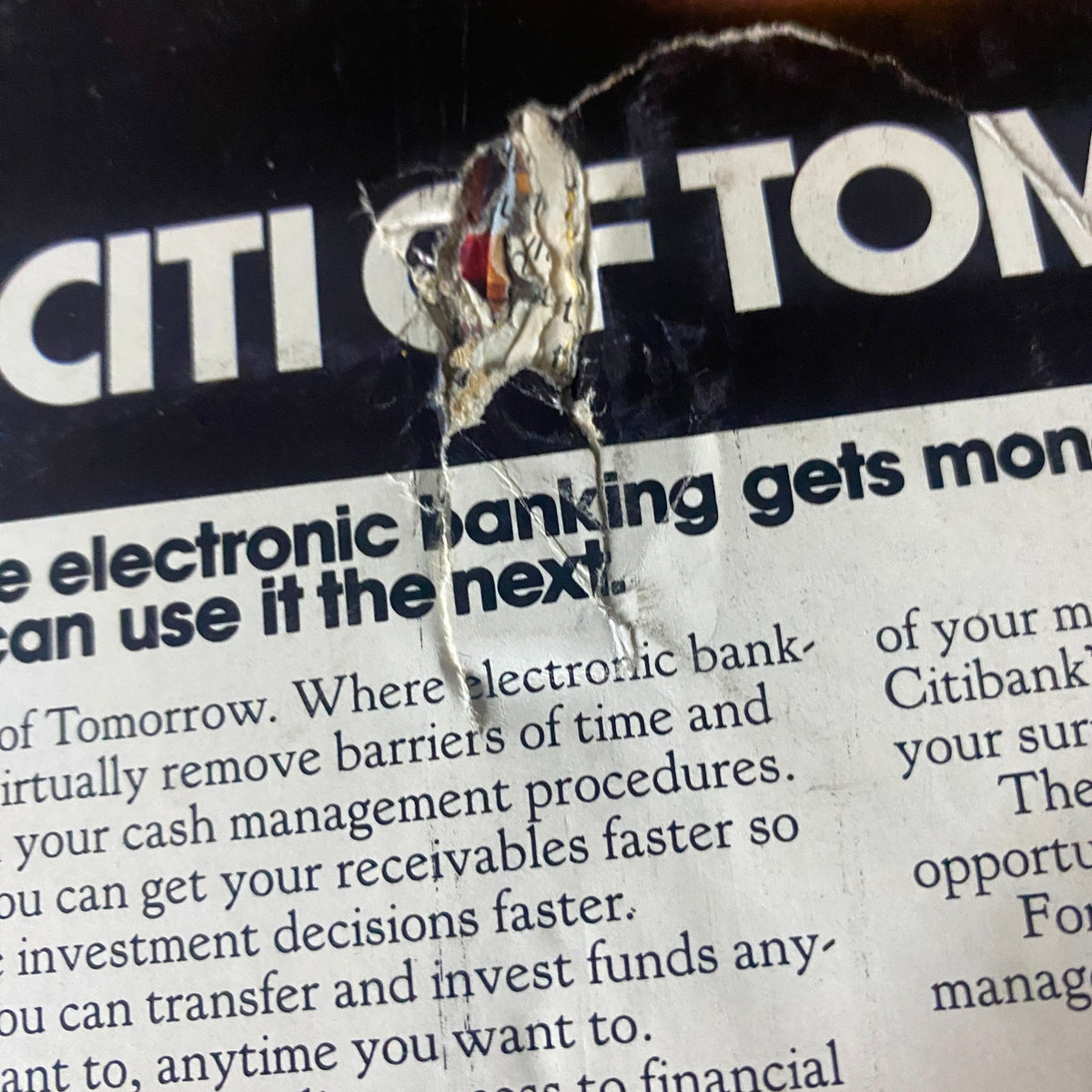 A close-up of a damaged section from the back cover of Fortune Magazine, October 18, 1982, featuring a Citi advertisement that discusses electronic banking innovations. This vintage magazine highlights Boeing's 757 and 767 aircraft alongside Airbus A310.