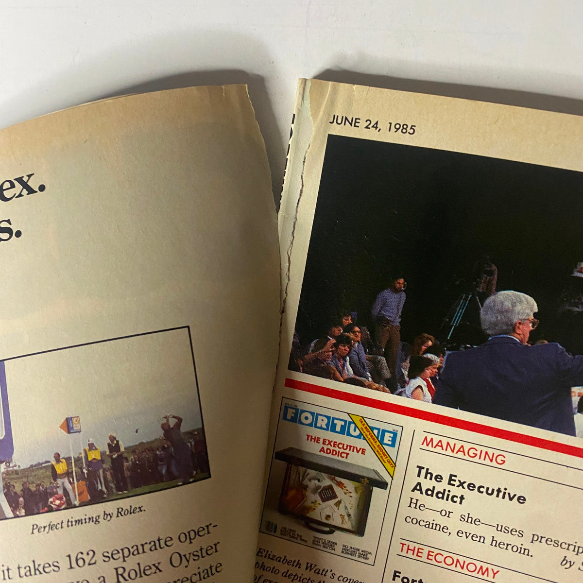Close-up of a page from Fortune Magazine June 24, 1985 showing the page layout with a preview of the magazine's content including 'The Executive Addict'.