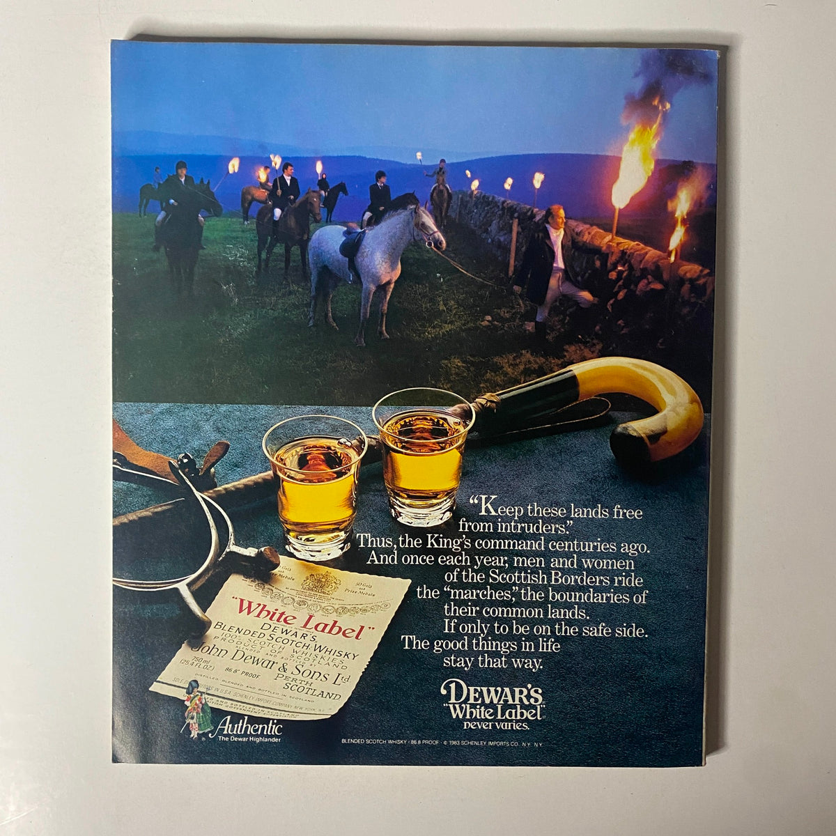 Back cover of Fortune Magazine May 16, 1983, featuring an advertisement for Dewar's White Label whisky, depicting riders and a scenic landscape, promoting the brand's heritage.