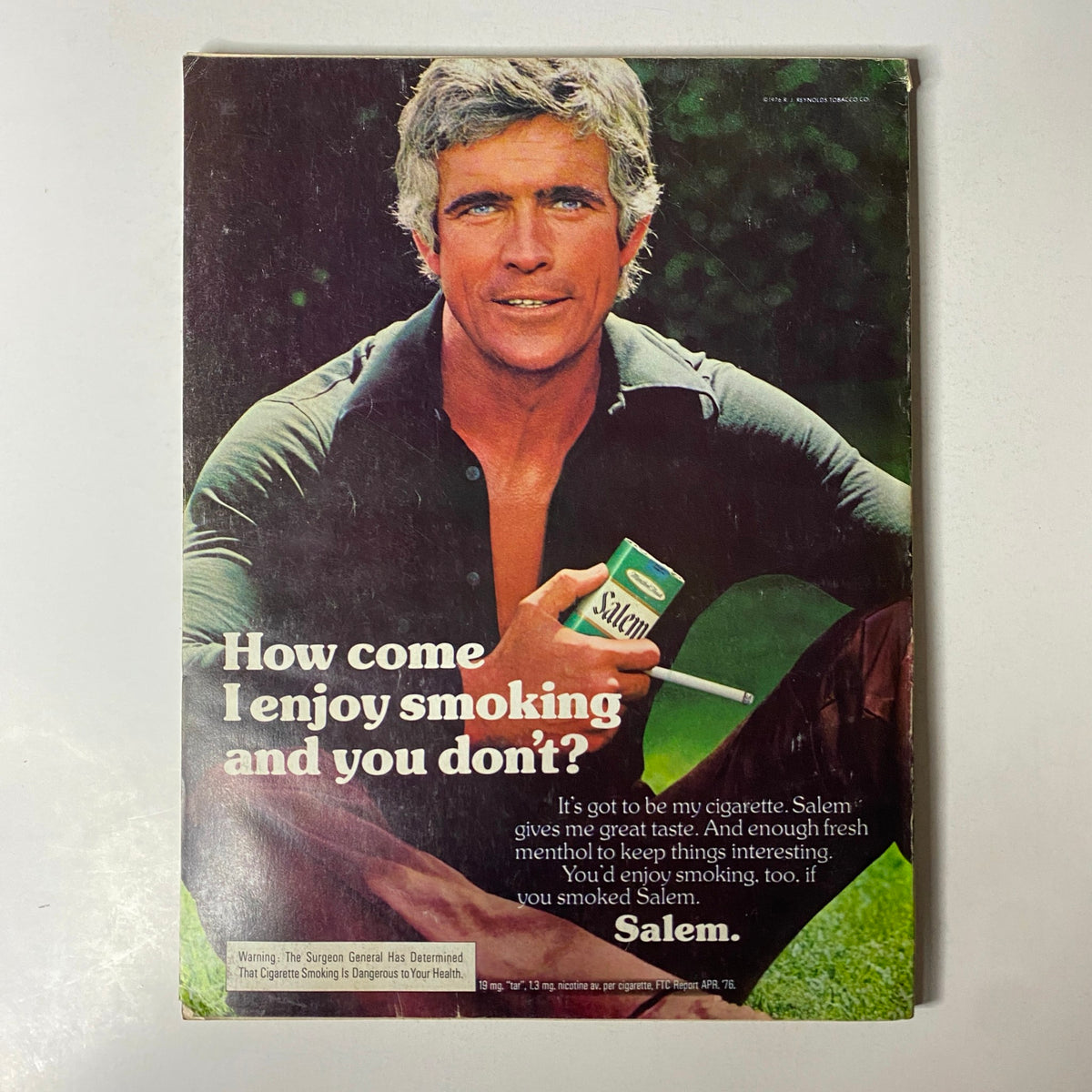 Back cover of Esquire Magazine February 1977 displaying a Salem cigarette advertisement featuring a distinguished man promoting smoking.