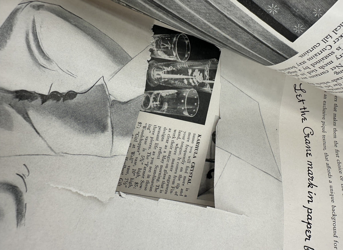 Artistic image showcasing a paper cutout and glassware, highlighting a historical moment from House Beautiful Magazine March 1939 Small House Competition Building Design.