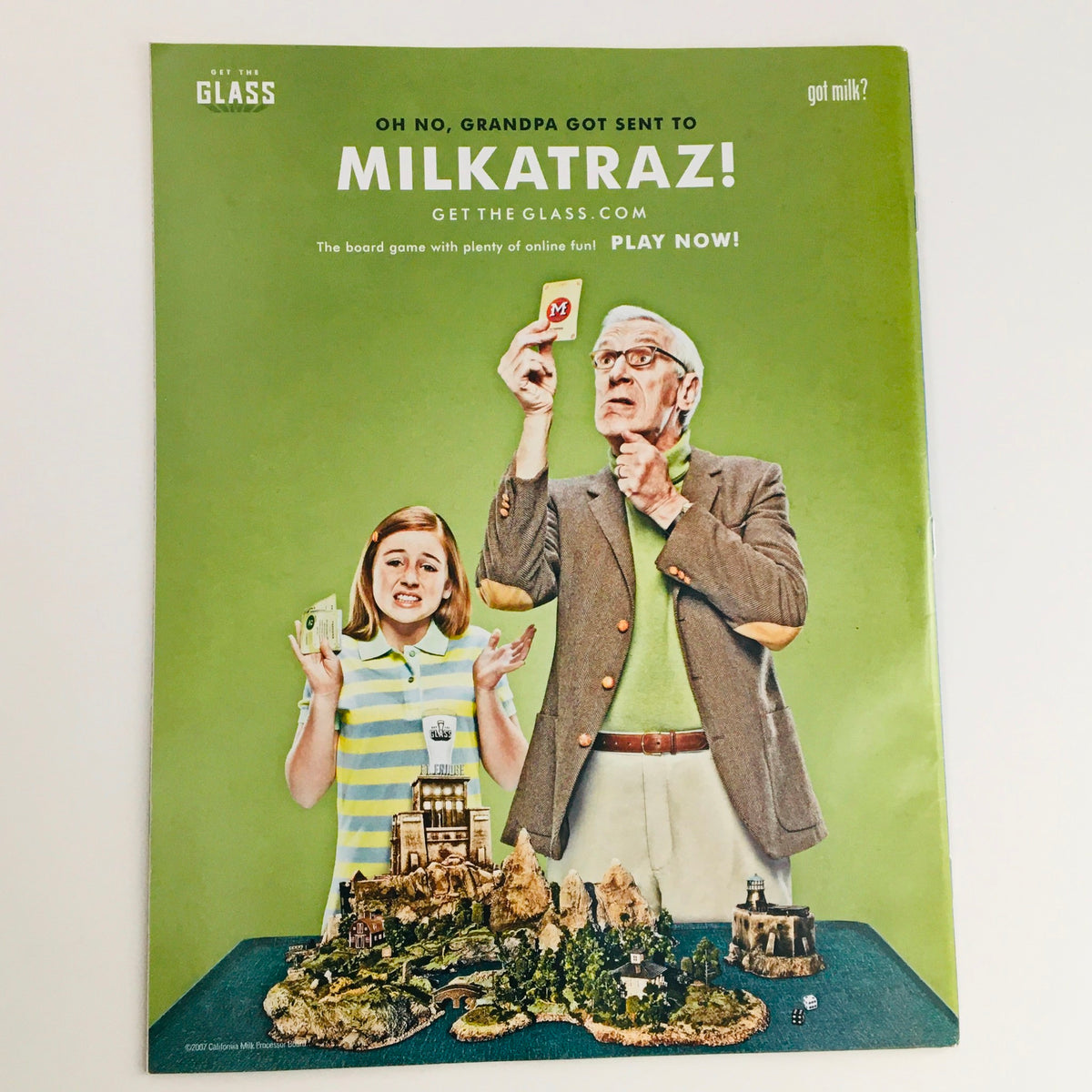 Back cover of Mad Magazine August 2007 No. 480 featuring a humorous advertisement for a board game 'Milkatrraz!' with an image of a child and an elderly man holding a game card.