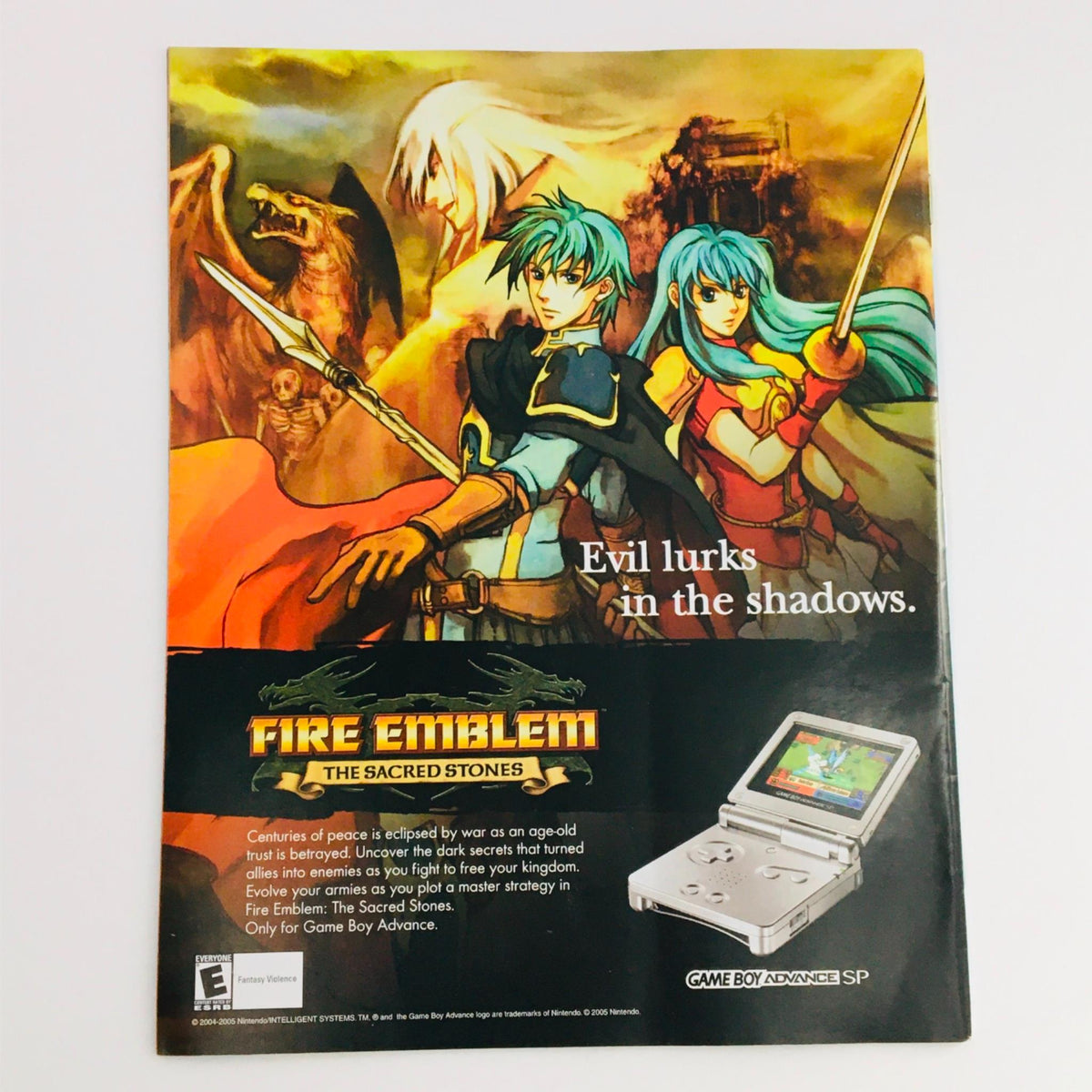 Back cover of Fire Emblem: The Sacred Stones advertisement with characters in a fantasy setting, depicting action and adventure.