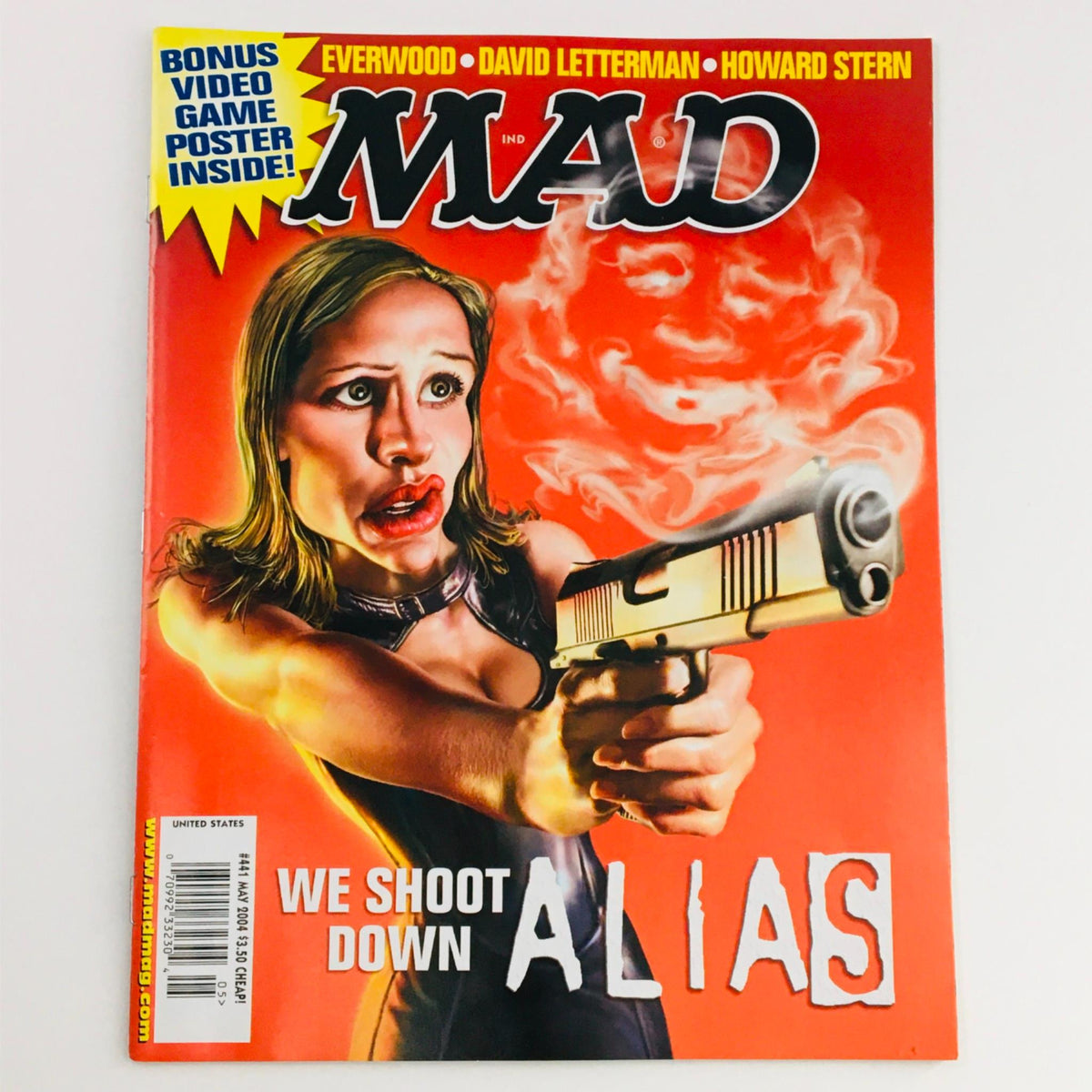 Mad Magazine May 2004 No. 441 cover featuring the parody 'We Shoot Down Alias' with a female character aiming a gun against a vibrant orange background, Very Fine VF 8.0 condition.