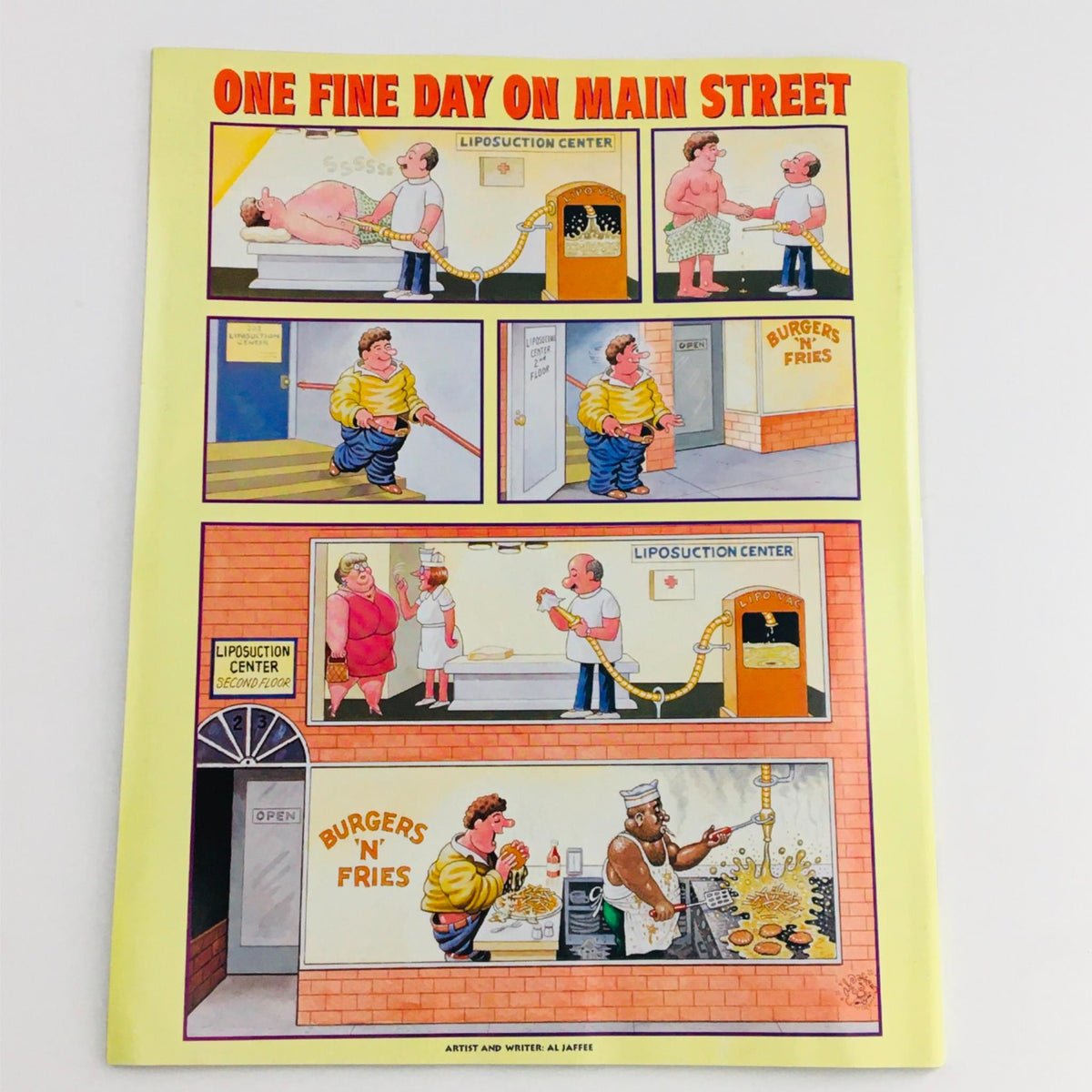 Mad Magazine February 2001 No. 402 cover art featuring a humorous cartoon titled 'One Fine Day on Main Street' depicting whimsical scenes involving a liposuction center and a fast-food restaurant. This illustration showcases the magazine's signature satirical style.