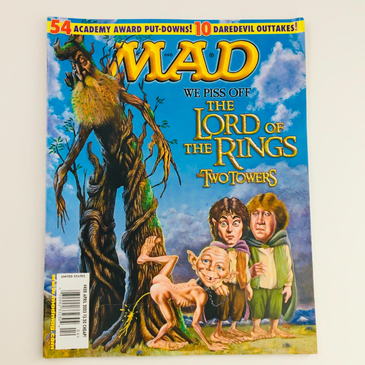 Cover of Mad Magazine April 2003 No. 428 featuring a humorous depiction of characters from The Lord of the Rings: The Two Towers, showcasing the magazine's signature satire and pop culture commentary.