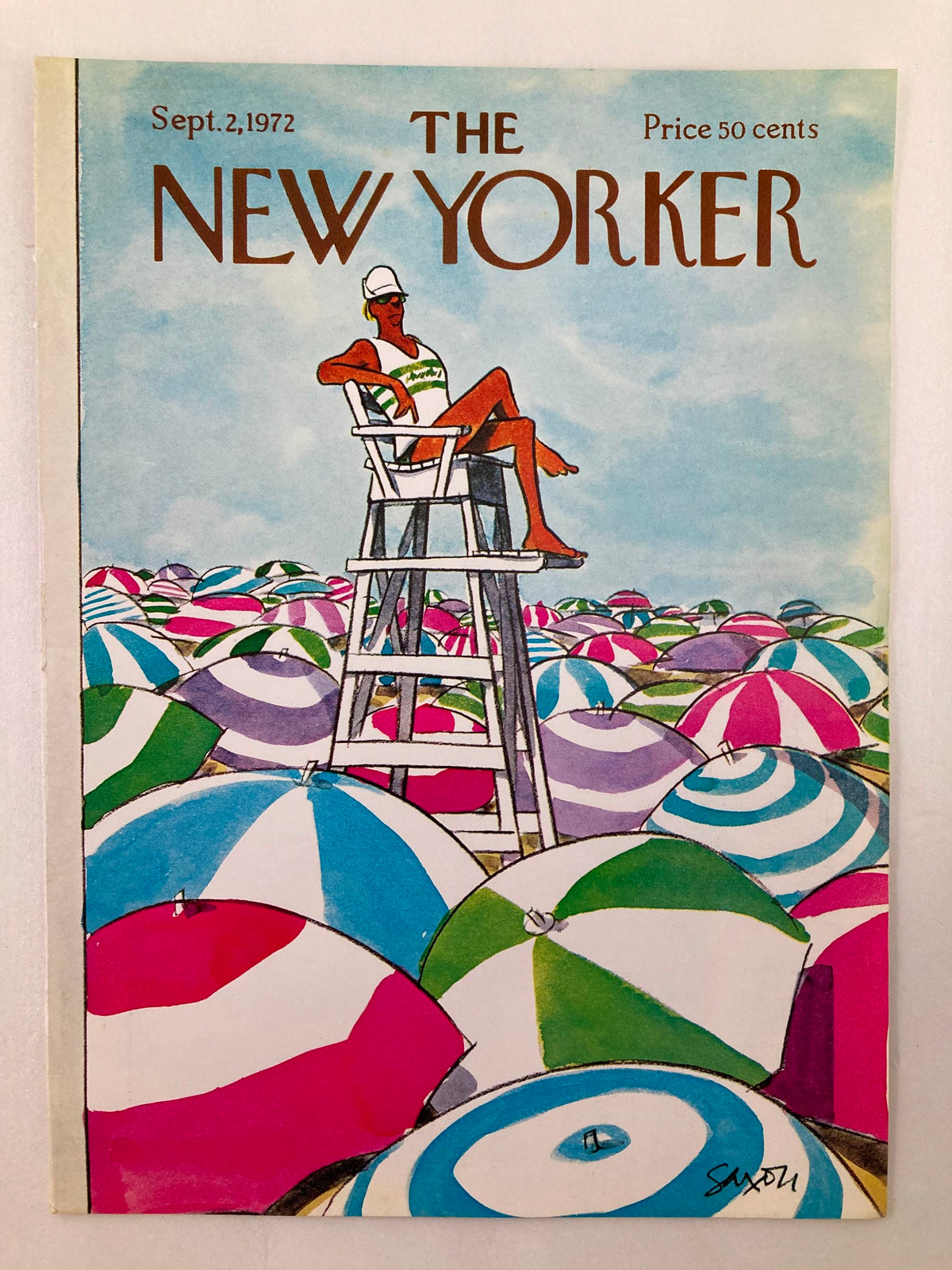 The New Yorker September 2, 1972 cover art by Charles Saxon, showcasing a lifeguard on a chair surrounded by vibrant beach umbrellas.