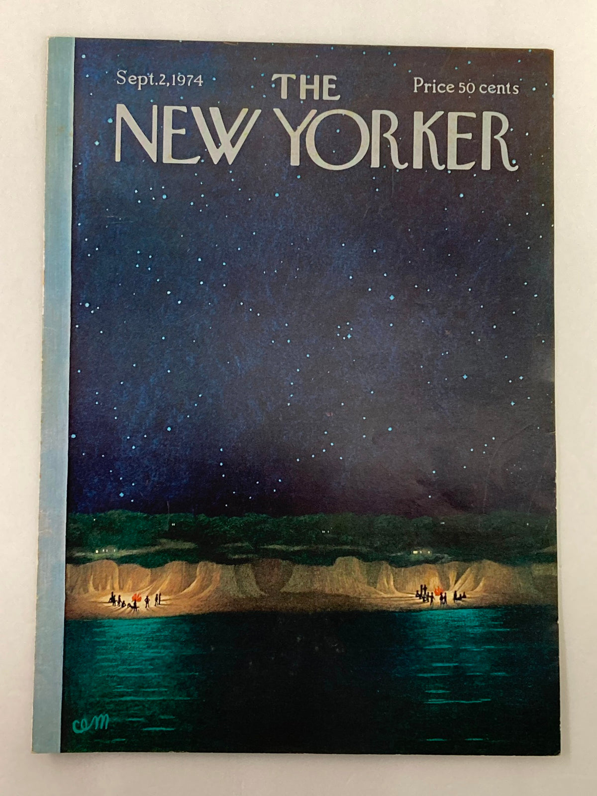 Photograph showing the cover of The New Yorker magazine, September 2, 1974, titled 'Bonfire' by Charles E. Martin, featuring a dark blue starry sky and silhouettes of people near water.