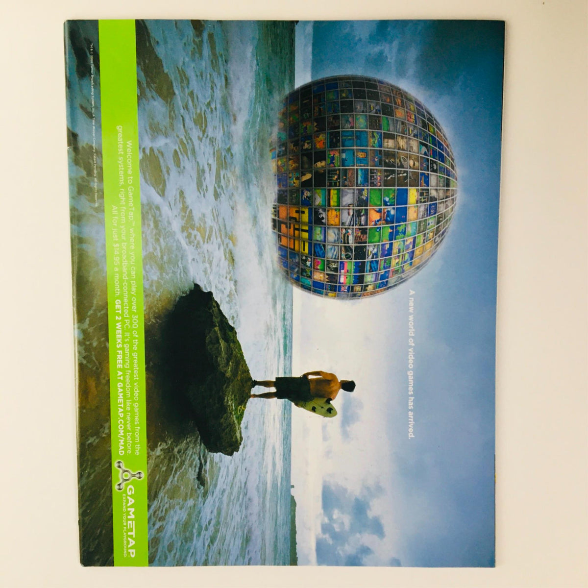 Back cover of Mad Magazine January 2006 No. 461 featuring an artistic image of a person on a rock viewing a globe made of images, promoting a sense of global awareness and creativity.