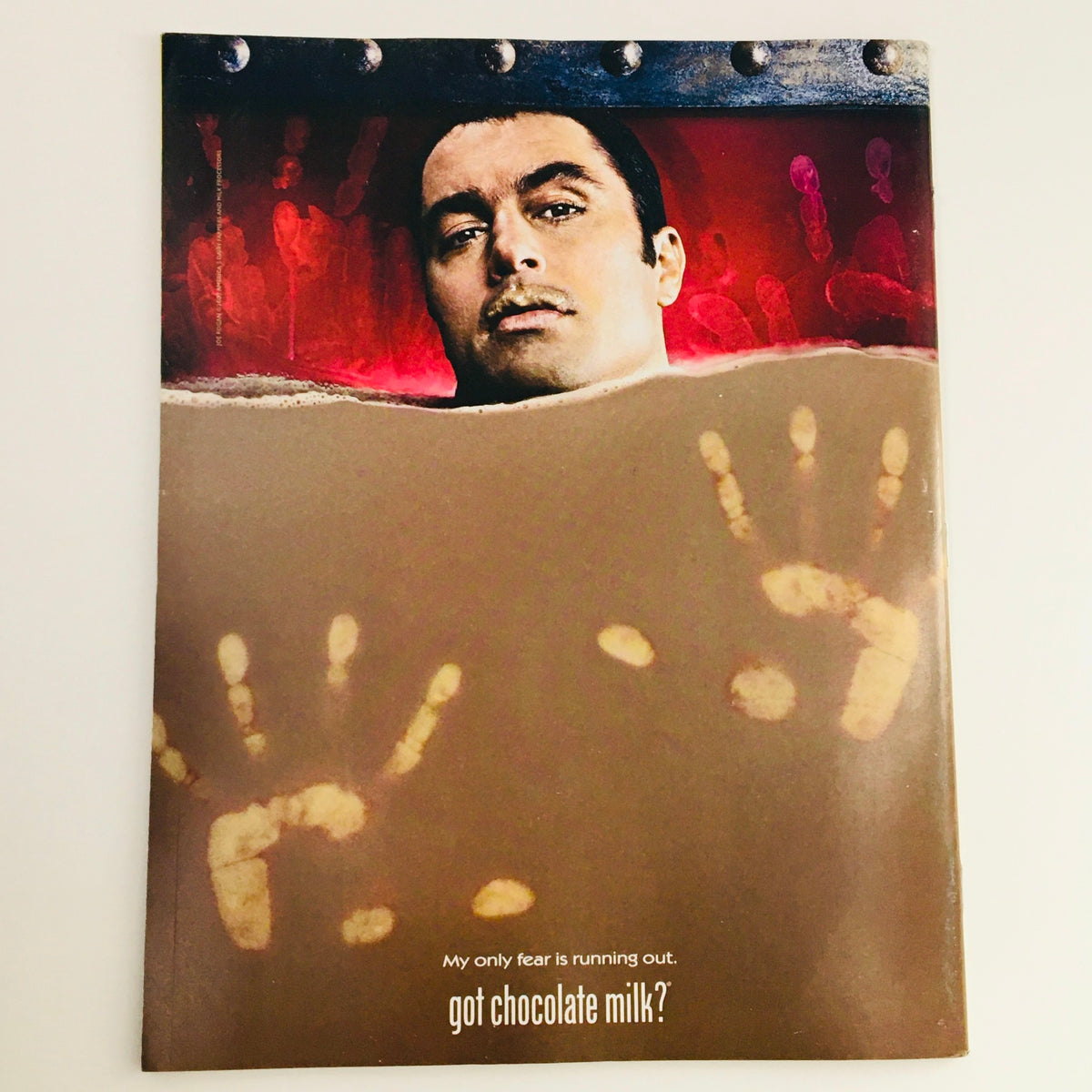 Cover image of Mad Magazine November 2002 No. 423 Golden Anniversary Edition, featuring a unique artistic design with a man and handprints, humorously asking 'got chocolate milk?'. This edition celebrates 50 years of Mad Magazine's satirical content, preserved in Very Fine VF 8.0 condition.
