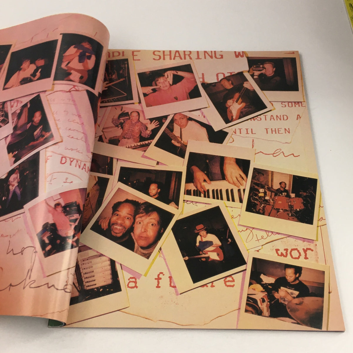 Interior page of Paul McCartney The New World Tour 1993 displaying a collage of Polaroid photos from performances.