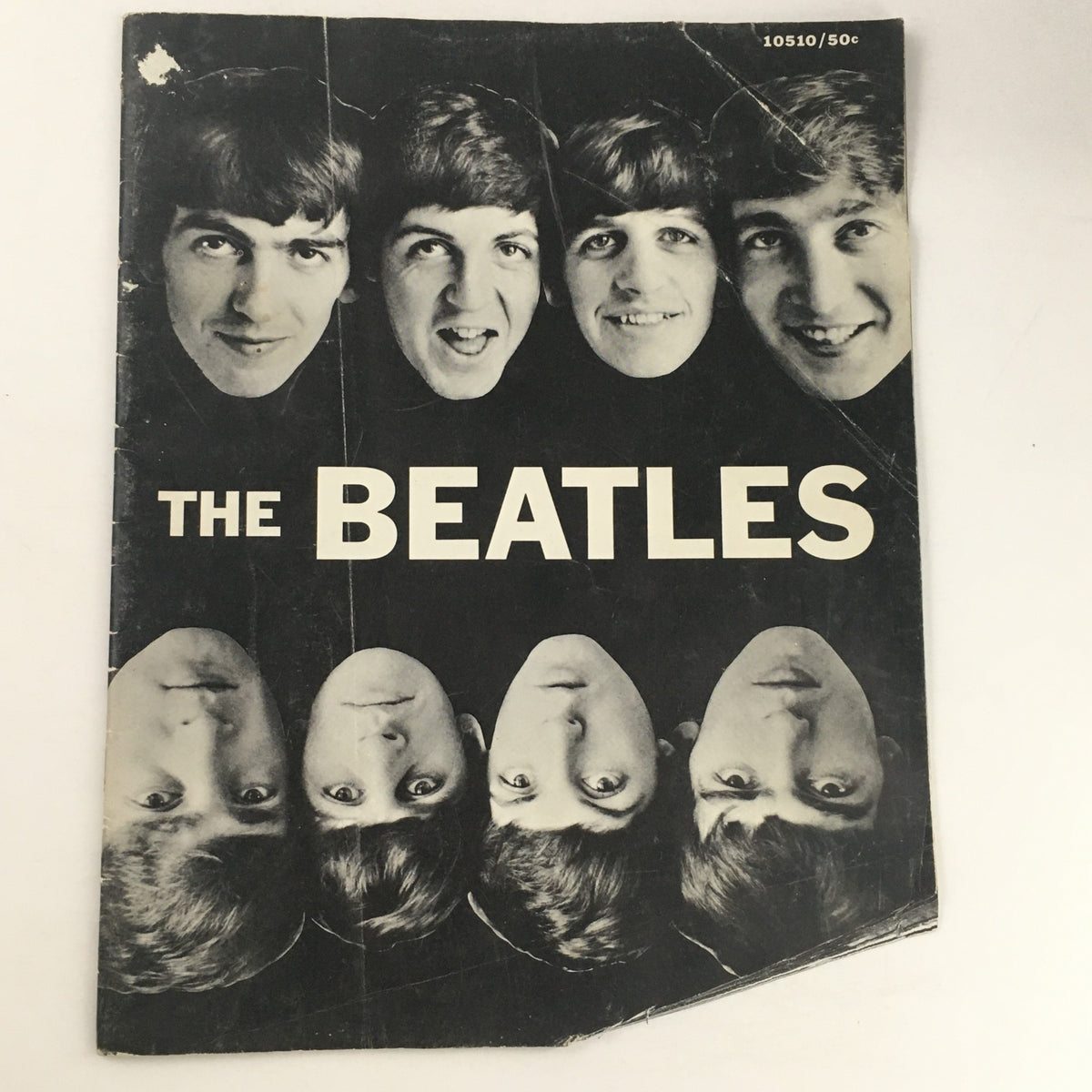 Cover of The Beatles magazine by Norman Parkinson, 1964, featuring a black and white portrait of The Beatles with distinct facial expressions.