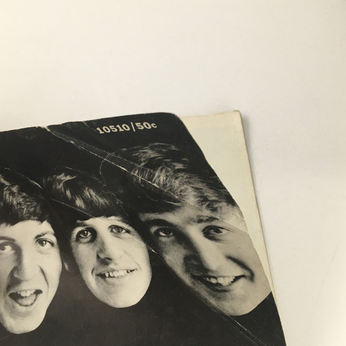Top part of The Beatles magazine by Norman Parkinson, 1964, showing smiling portraits of band members with magazine pricing detail.