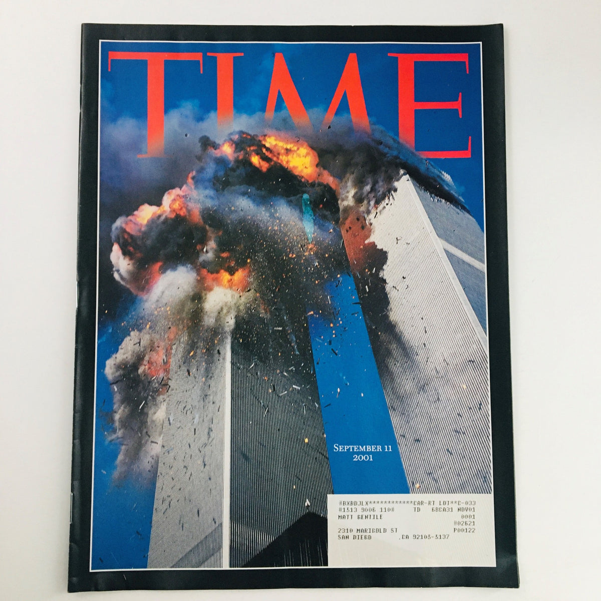 Time Magazine September 11 2011 cover featuring the iconic image of the Twin Towers during the 9/11 attacks, under the title America's The Day of Infamy.