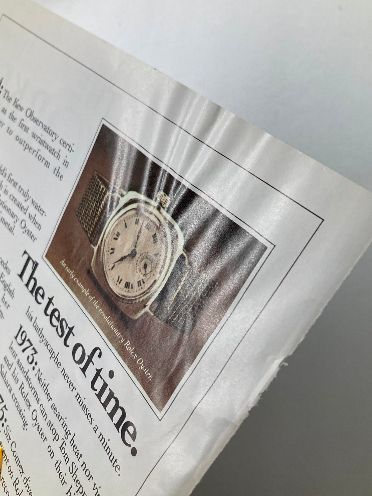 Close-up image of the inner page from a vintage magazine featuring an advertisement for a Rolex watch, with notable crinkles suggesting wear. This page is part of The New Yorker issue dated November 3, 1986, known for its rich cultural commentary from the era.
