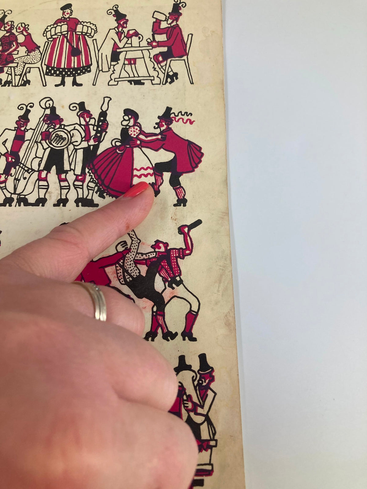 Detailed view of the 1937 The Center Theatre Playbill featuring William Gaxton in White Horse Inn, focusing on colorful depictions of dancers and performers in a lively theatre setting.