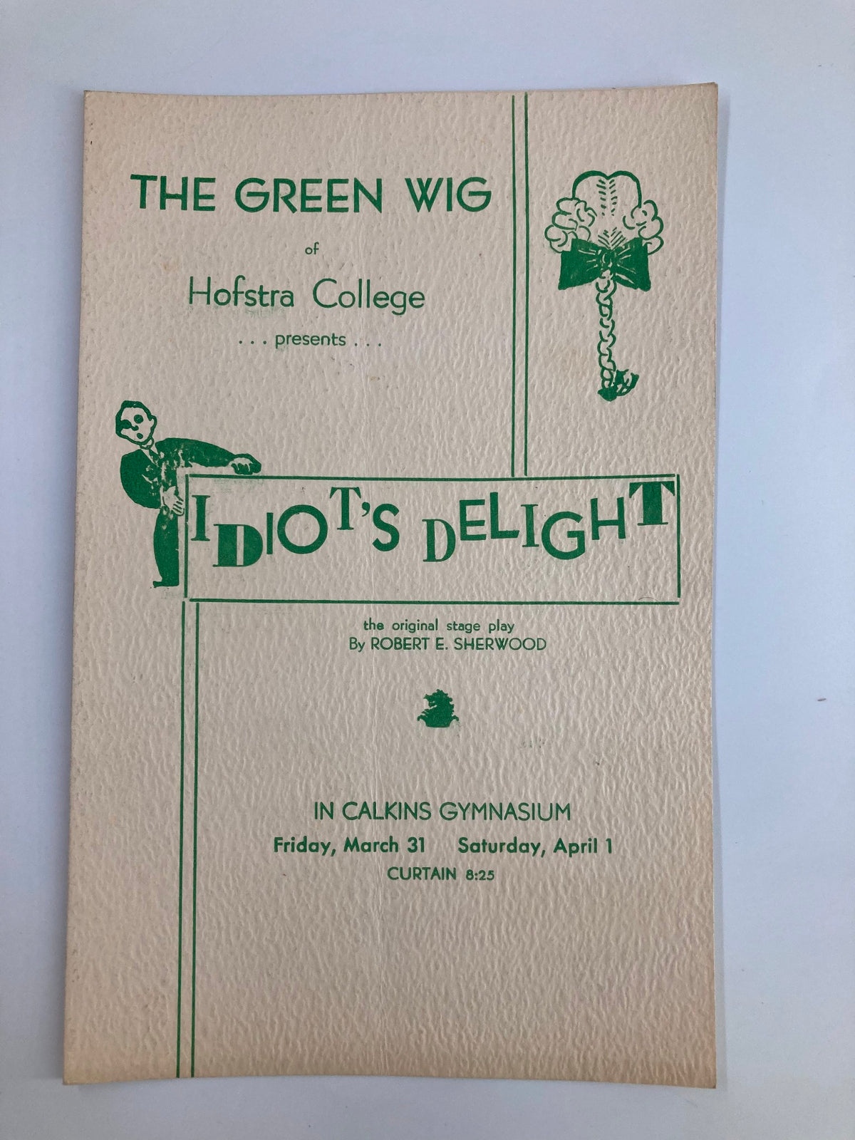 Front cover of the 1936 Playbill for 'The Green Wig of Hofstra College Idiot's Delight' by Robert E. Sherwood, featuring artistic illustrations and event details.