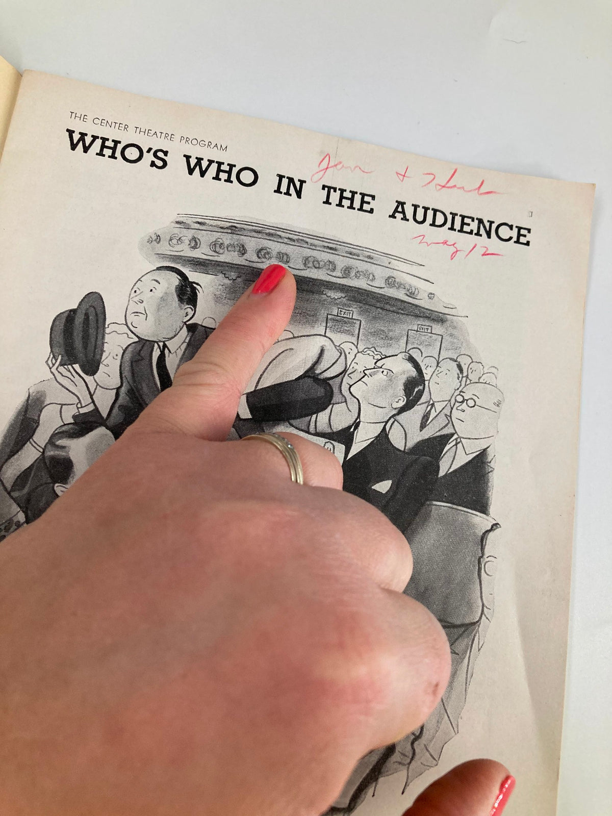 Inside view of a 1939 Center Theatre program for The American Way, showcasing a whimsical drawing of the audience with handwritten notes and annotations, reflecting the theatrical experience of the era.