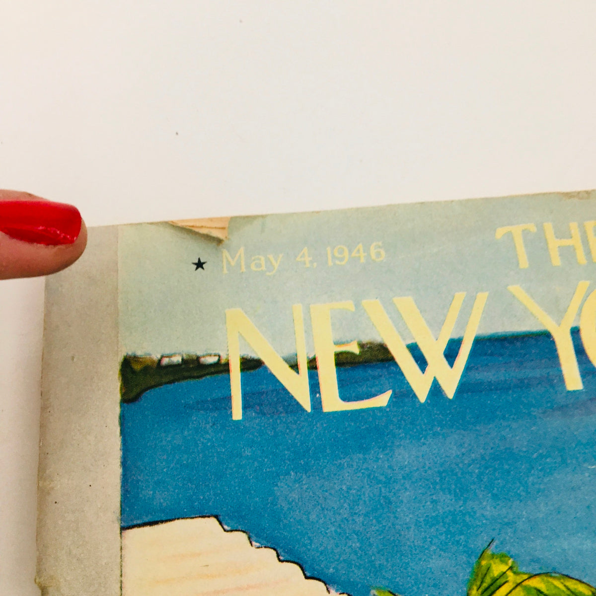 Close-up view of The New Yorker May 4 1946 magazine cover featuring a picturesque coastal scene and the magazine title prominently displayed in elegant typography.